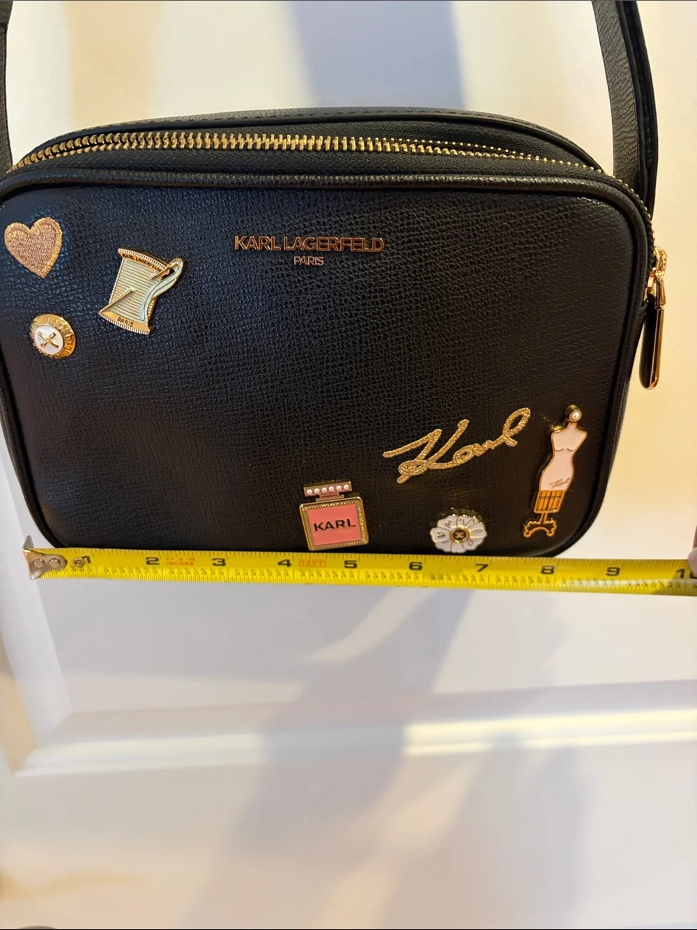 Karl Lagerfeld Black Crossbody Camera Bag with Gold & Pink Charm Accents